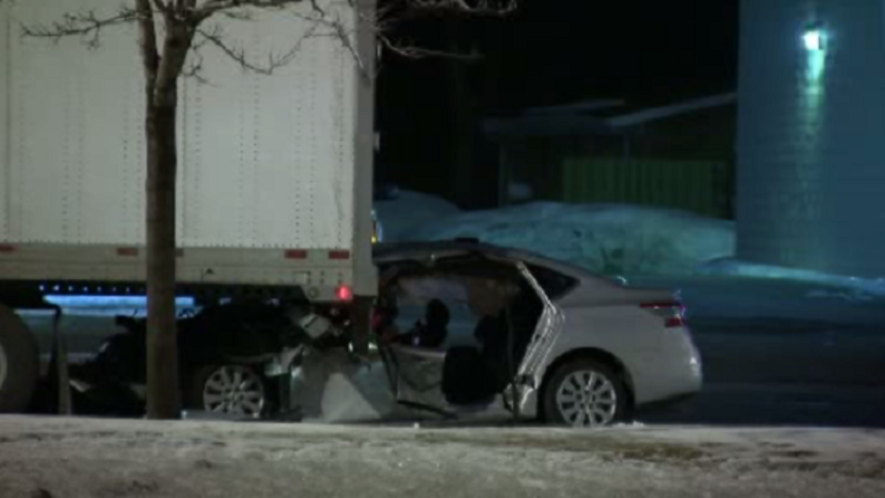 2 critically injured after driving car into back of semi truck