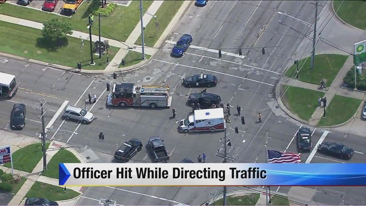 Warren police officer hospitalized after being hit by pickup